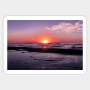 Orange and blue sunset on a beach Sticker